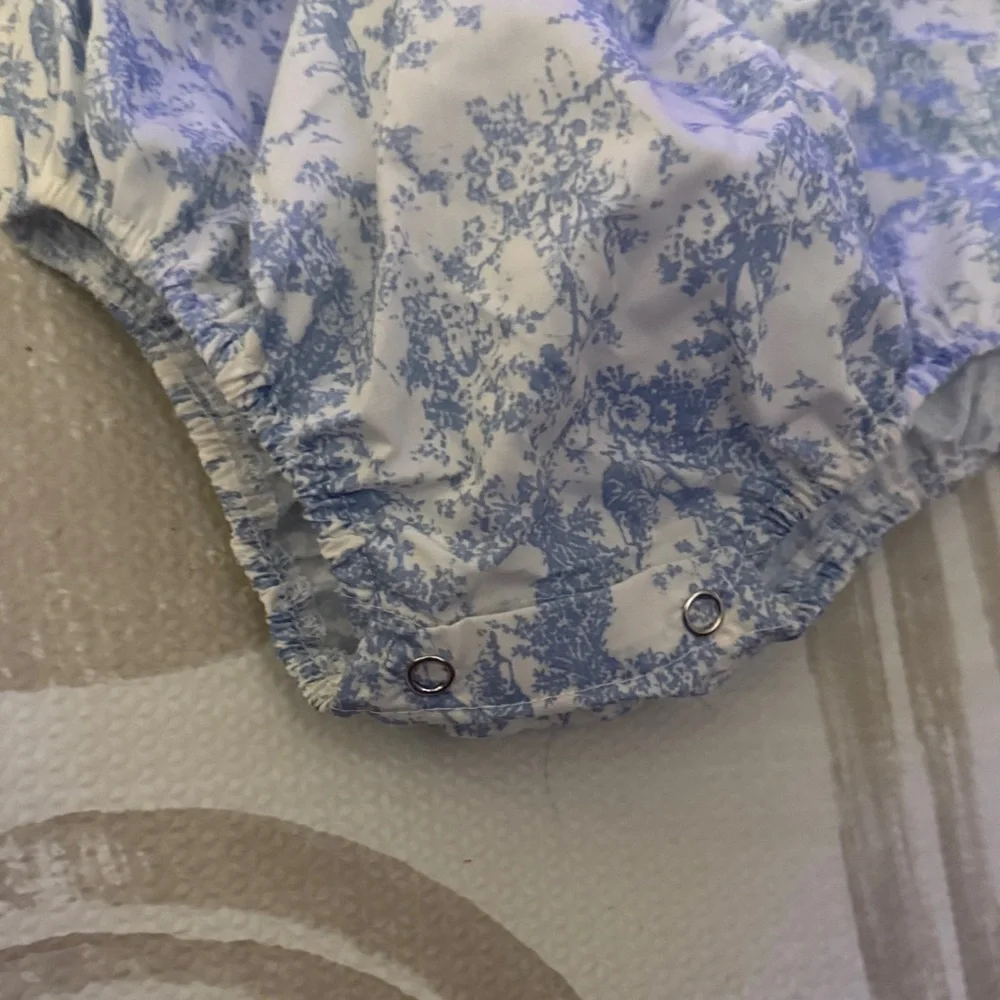 Smocked Puff-Sleeve Baby Romper in Blue Toile